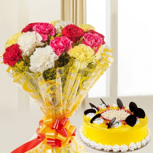 Gift hamper of 12 mix colour carnation bunch with half kg pineapple cake