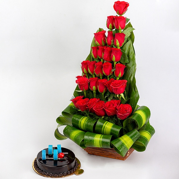 Basket arrangement of 27 Red Roses in Standing way and with Half kg chocolate truffle cake