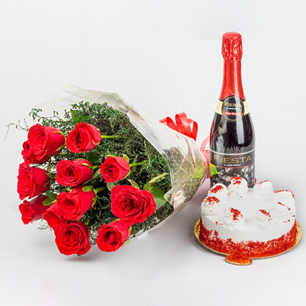 Buy gift combo of 12 Red Roses bunch and half kg Red velvet cake and non alcholic Fiesta champagne.