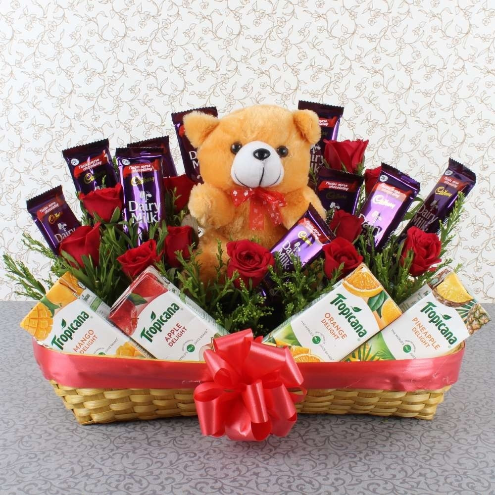 Gift Basket Of 12 Red Roses + 10 Dairy Milk + 4 Pack Of Tropicana Juices + 6 Inch Cute Teddy Bear.