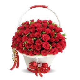 A White Basket Container Of 70 Red Roses