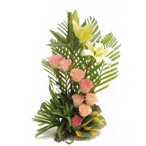 Spring Garden -  A Basket Arrangement Of 8 Pink Roses With 2 White Lilies 